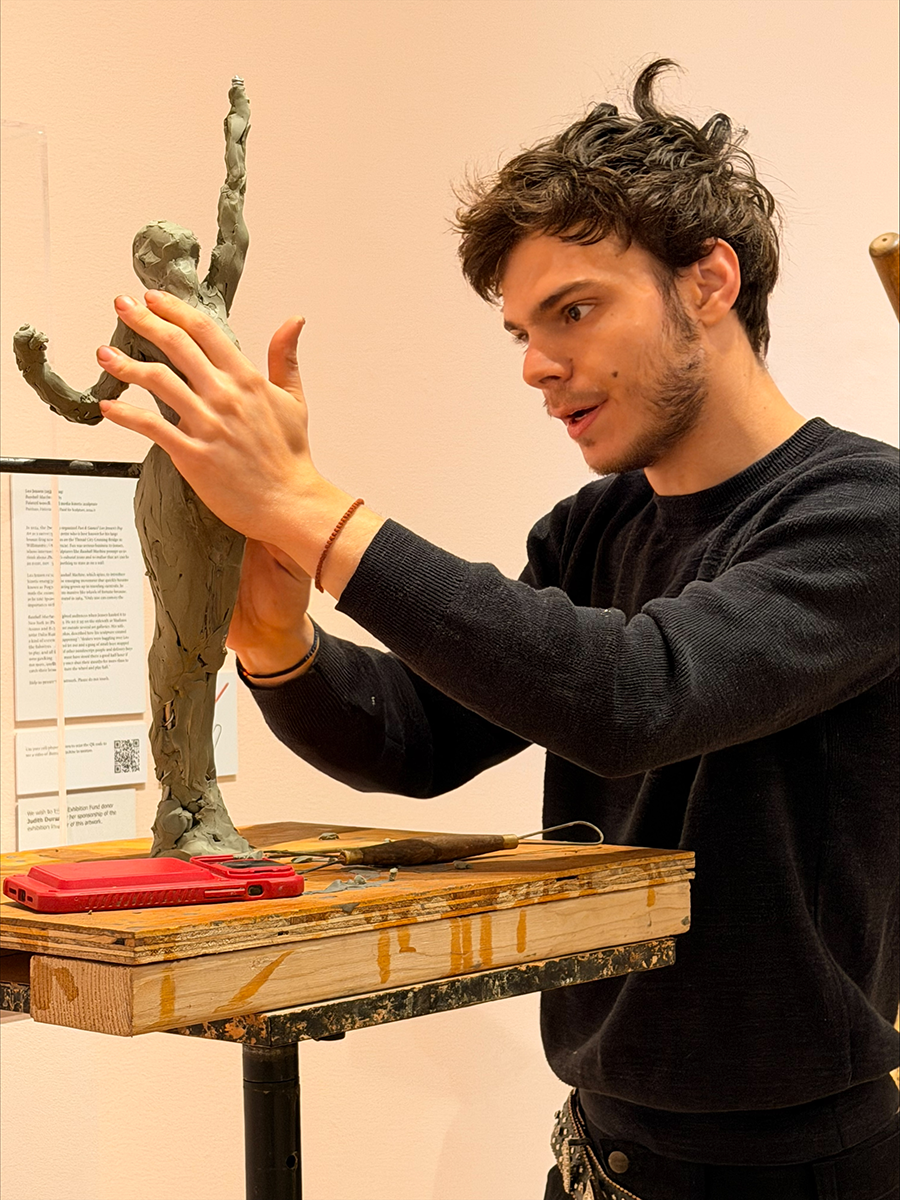 artist sculpting with clay -